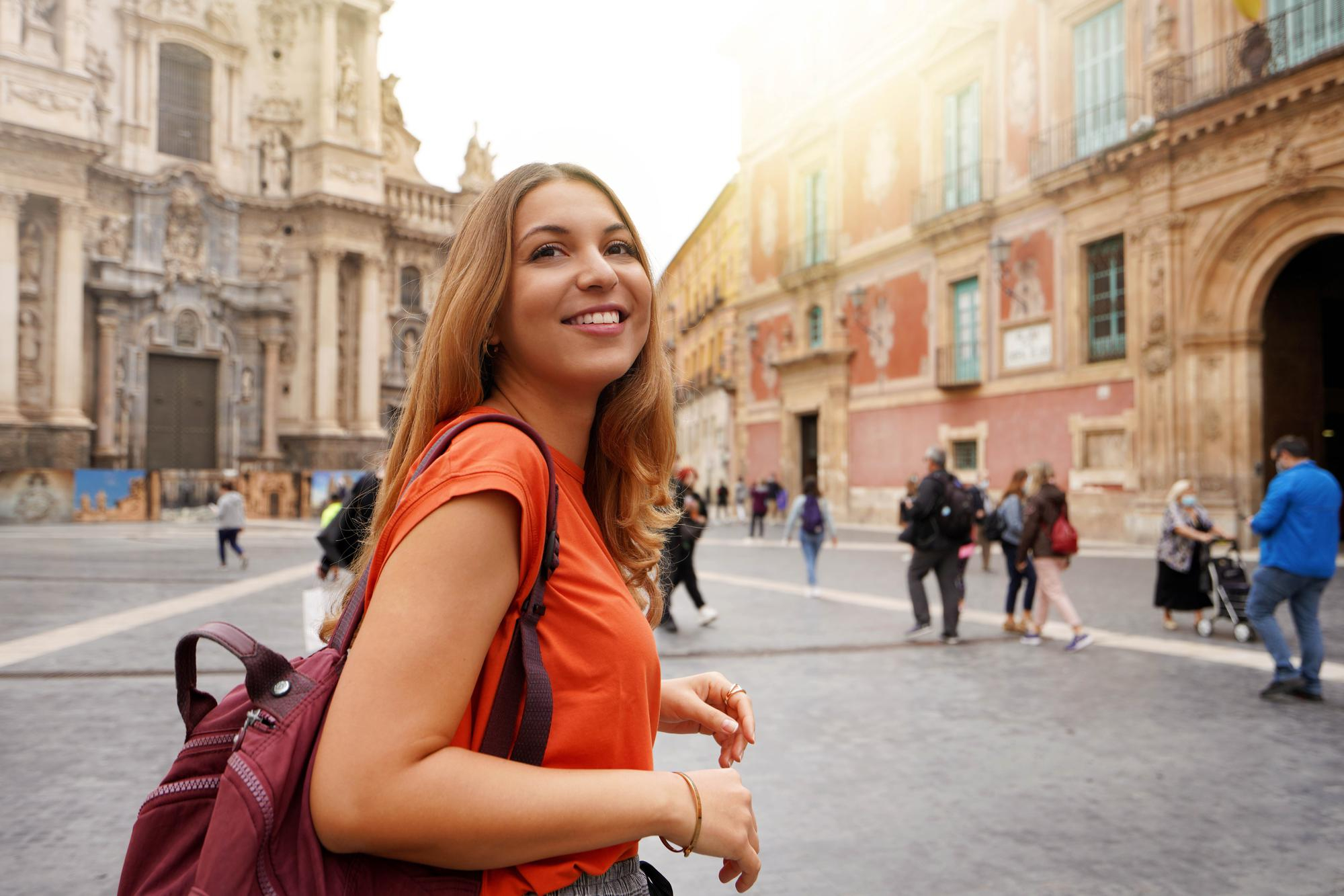 beautiful-excited-school-exchange-girl-visiting-europe-within-exchange-program